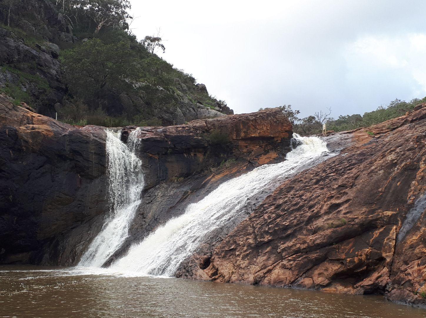 Serpentine falls - water flowing over rocks into a rock pool