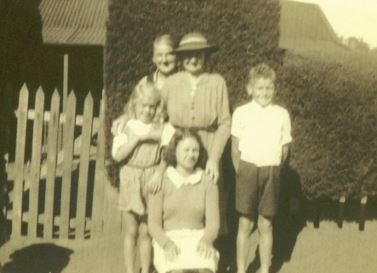 black and white image of a family in pioneer dress